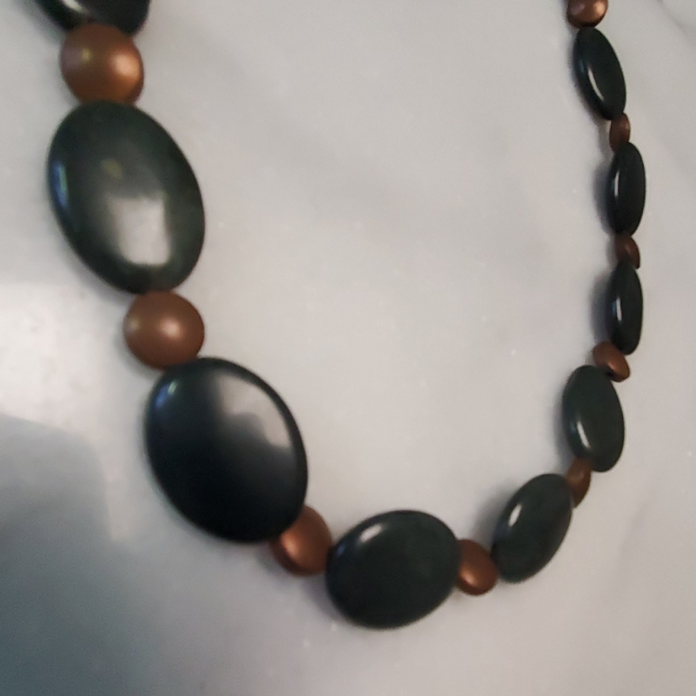 Dark jade and copper color headed necklace